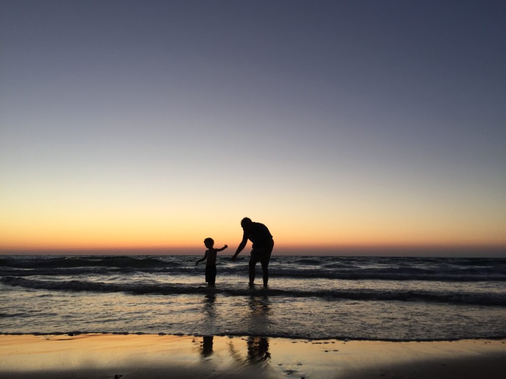 Grandfather and child at the beach

